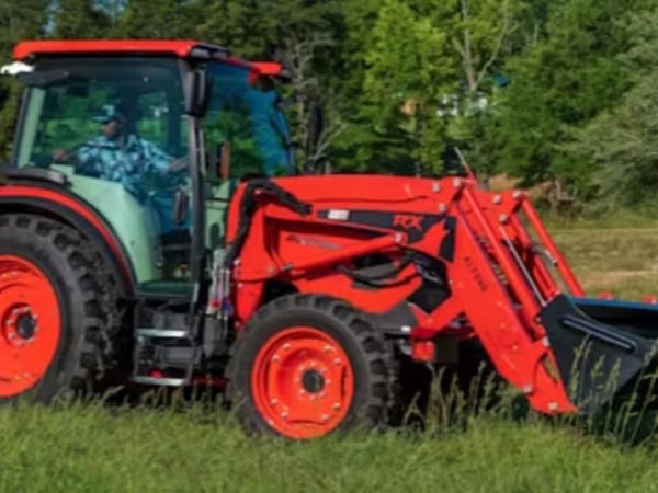 Kioti 75hp tractor with front loader working on a Central Texas ranch property